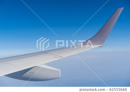 Airplane blue sky and wings 62555688