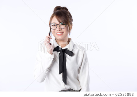 Young Asian girl happily talking on the phone 62555898