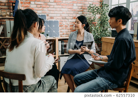 employees sit in circle in coworking space employees sit in circle in coworking space 62557310