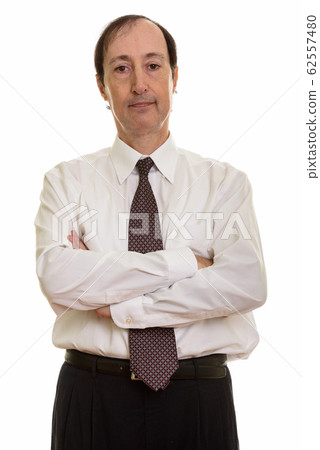 Studio shot of mature businessman with arms crossed 62557480