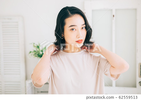 Young woman hairstyle short bob 62559513