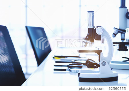Microscope and test tubes with lab glassware in Microscope and test tubes with lab glassware in 62560555