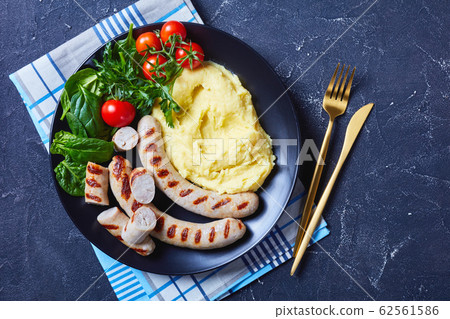Pommes aligot with sausage and fresh salad Pommes aligot with sausage and fresh salad 62561586