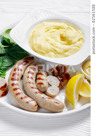 Potatoes aligot with sausage and dijon mustard Potatoes aligot with sausage and dijon mustard 62561588