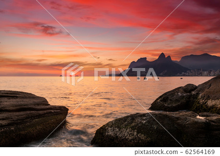 Sunset on the ocean at Rio de Janeiro, Ipanema beach. Brazil 62564169