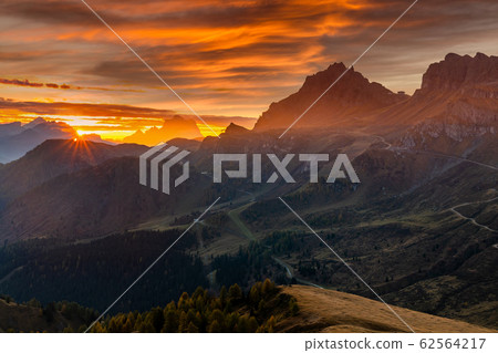 Misty sunrise at Pass Pordoi. Dolomites mountains, Italy 62564217