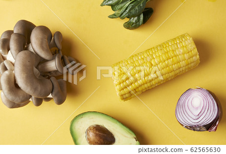 vegetables on yellow background vegetables on yellow background 62565630