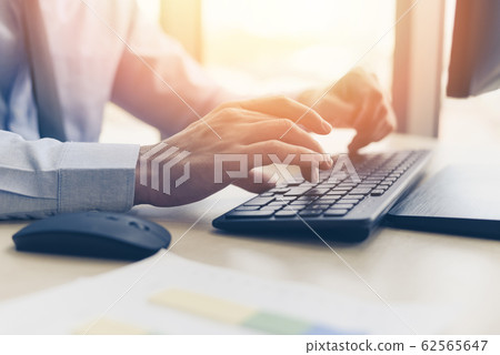 Businessman working on keyboard and mouse computer Businessman working on keyboard and mouse computer 62565647