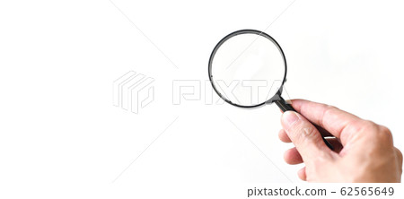 Hand holding magnifying glass isolated on white Hand holding magnifying glass isolated on white 62565649