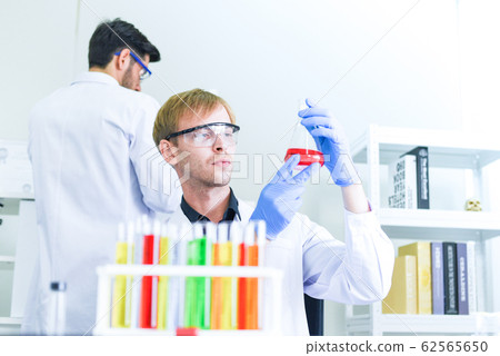 Man doctor as male scientist team doing some 62565650