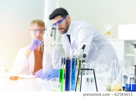 Man doctor as male scientist team doing some Man doctor as male scientist team doing some 62565651