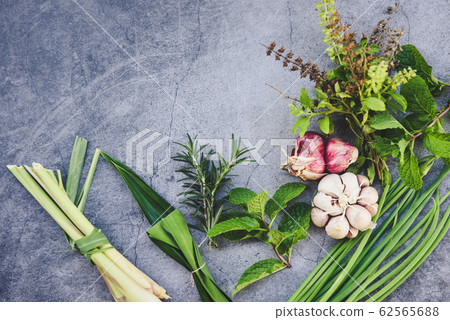 Natural fresh herbs and spice on black plate in 62565688