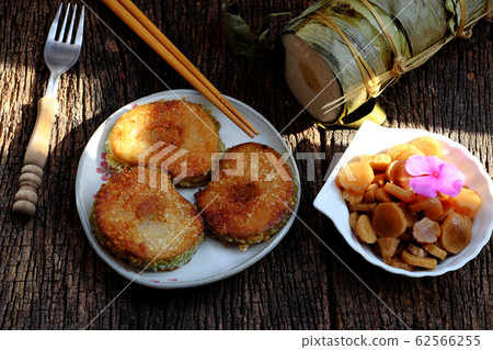 Vietnamese traditional food for Tet, delicious fried glutinous rice cake on plate Vietnamese traditional food for Tet, delicious fried glutinous rice cake on plate 62566255