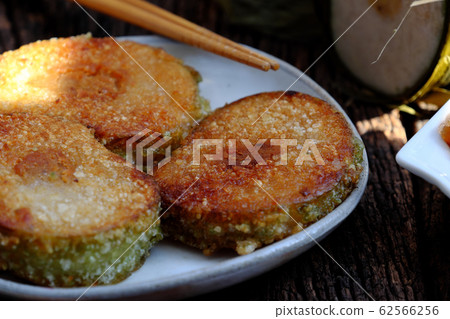 Vietnamese traditional food for Tet, delicious fried glutinous rice cake on plate Vietnamese traditional food for Tet, delicious fried glutinous rice cake on plate 62566256