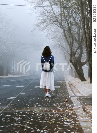 early morning with girl standing looking Stock Photo