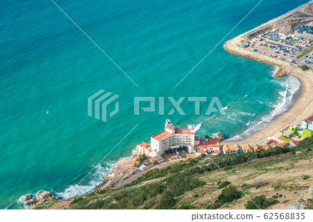 panorama of exotic coast with hotel by the sea with crystal clear tercis color water, paradise for relaxation panorama of exotic coast with hotel by the sea with crystal clear tercis color water, paradise for relaxation 62568835