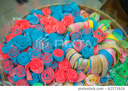 Assortment of colorful delicious marmalade jelly candies on counter of shop Assortment of colorful delicious marmalade jelly candies on counter of shop 62572626