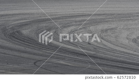 Asphalt race track detail with tire mark 62572810