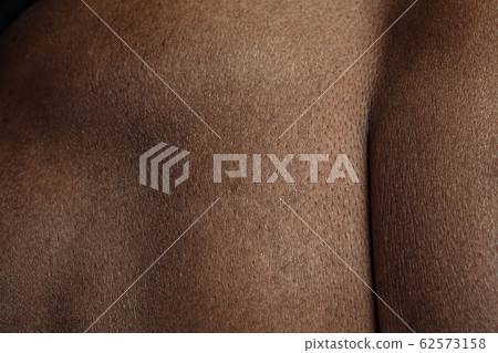 Texture of human skin. Close up of african-american male body 62573158
