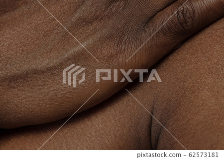 Texture of human skin. Close up of african-american male body 62573181
