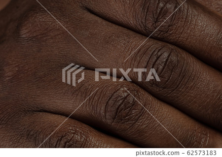 Texture of human skin. Close up of african-american male body Texture of human skin. Close up of african-american male body 62573183