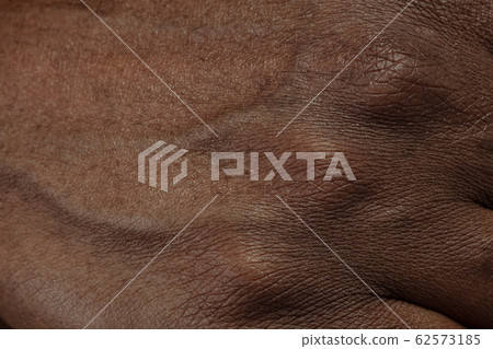 Texture of human skin. Close up of african-american male body 62573185