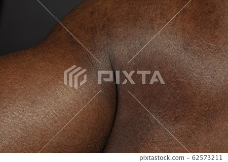 Texture of human skin. Close up of african-american male body 62573211
