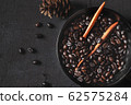 Roasted coffee beans in a bowl 62575284