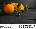Fresh citrus fruit on the table 62575517