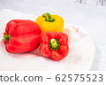 Fresh paprika on the wooden background 62575523