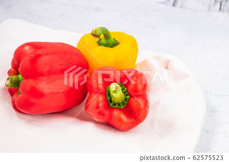 Fresh paprika on the wooden background Fresh paprika on the wooden background 62575523