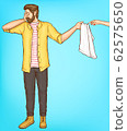 Shy man cover eyes with hand giving towel to woman 62575650