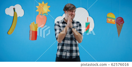 Man fascinated by unhealthy fast food 62576016