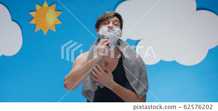 Man cutting his face while shaving 62576202