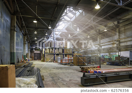 An empty production warehouse and industrial 62576356
