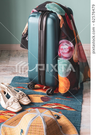 Suitcase and summer things. Fees on vacation at sea. Suitcase and summer things. Fees on vacation at sea. 62576479