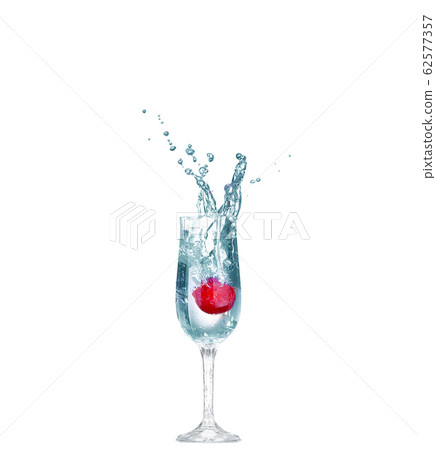 Strawberry splash in a cocktail glass on white Strawberry splash in a cocktail glass on white 62577357