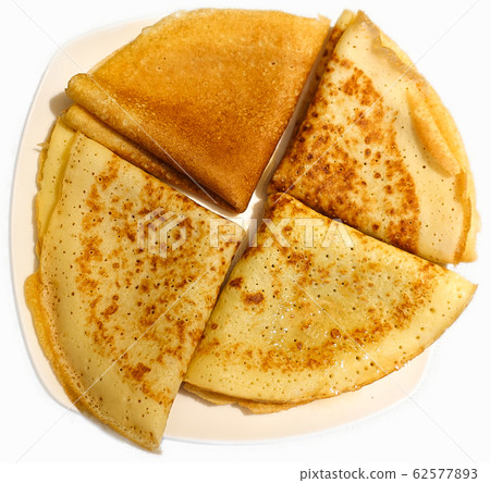 Traditional Russian pancakes on a plate. Handmade. 62577893