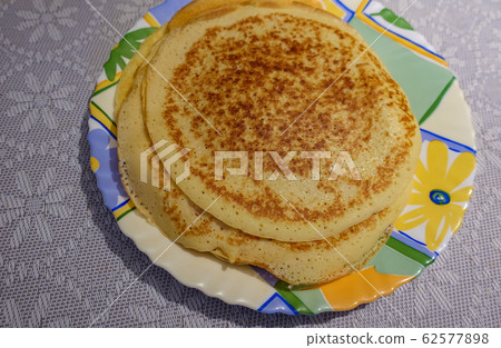 A stack of pancakes cooked at home. On the plate. A stack of pancakes cooked at home. On the plate. 62577898