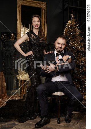 Happy family is waiting for Christmas Happy family is waiting for Christmas 62579403