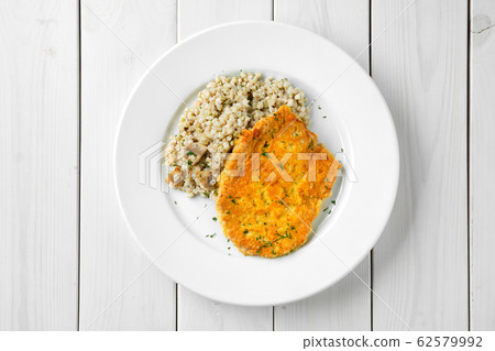 Top view of schnitzel with green buckwheat Top view of schnitzel with green buckwheat 62579992