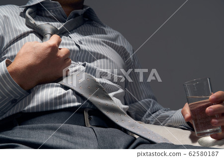 businessman with poor health, hands close view - businessman with poor health, hands close view - 62580187