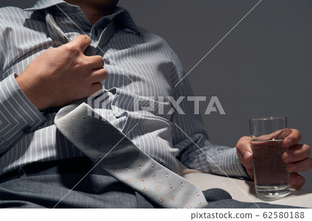 businessman with poor health, hands close view - businessman with poor health, hands close view - 62580188