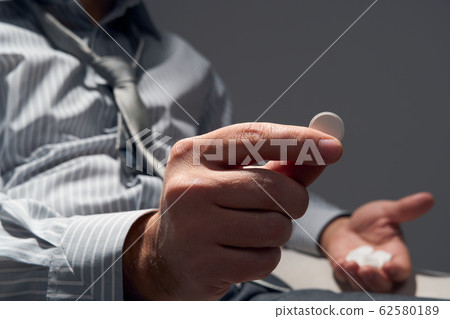 businessman with poor health, hands close view - businessman with poor health, hands close view - 62580189