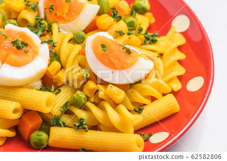 Curry flavor of short pasta Curry flavor of short pasta 62582806