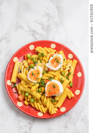 Curry flavor of short pasta Curry flavor of short pasta 62582809