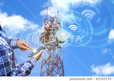 Digital alarm icon and man using smart phone 62585170