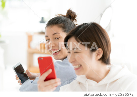 Female room share smartphone 62586572