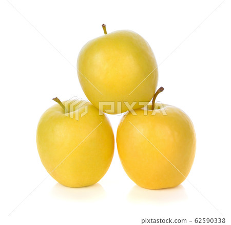 Fresh yellow apple isolated on white background Fresh yellow apple isolated on white background 62590338