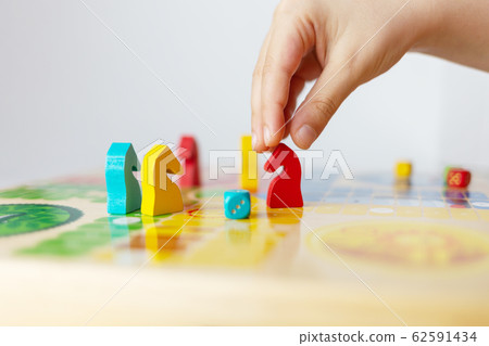 board game kids leisure concept, colorful play figurine with dice, ludo 62591434